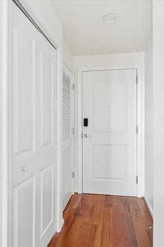 a view of a room with wooden floor