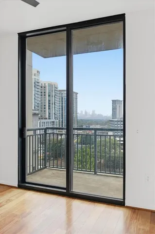 a view of a glass door and a window