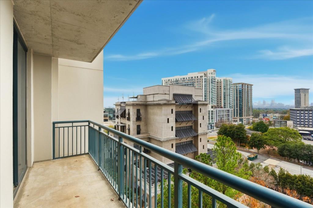 3040 Peachtree Road Northwest, Unit 805 Atlanta, GA 30305 - Photo 24 of 36 a view of a balcony with an outdoor space