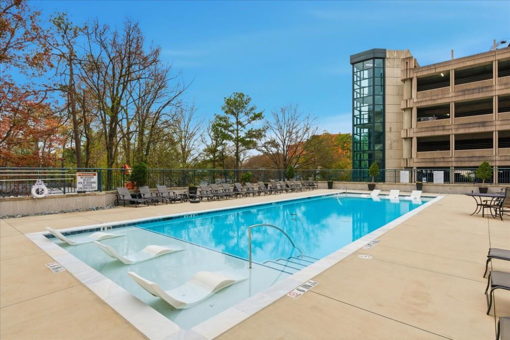 3040 Peachtree Road Northwest, Unit 805 Atlanta, GA 30305 - Photo 31 of 36 a view of swimming pool with outdoor seating and city view