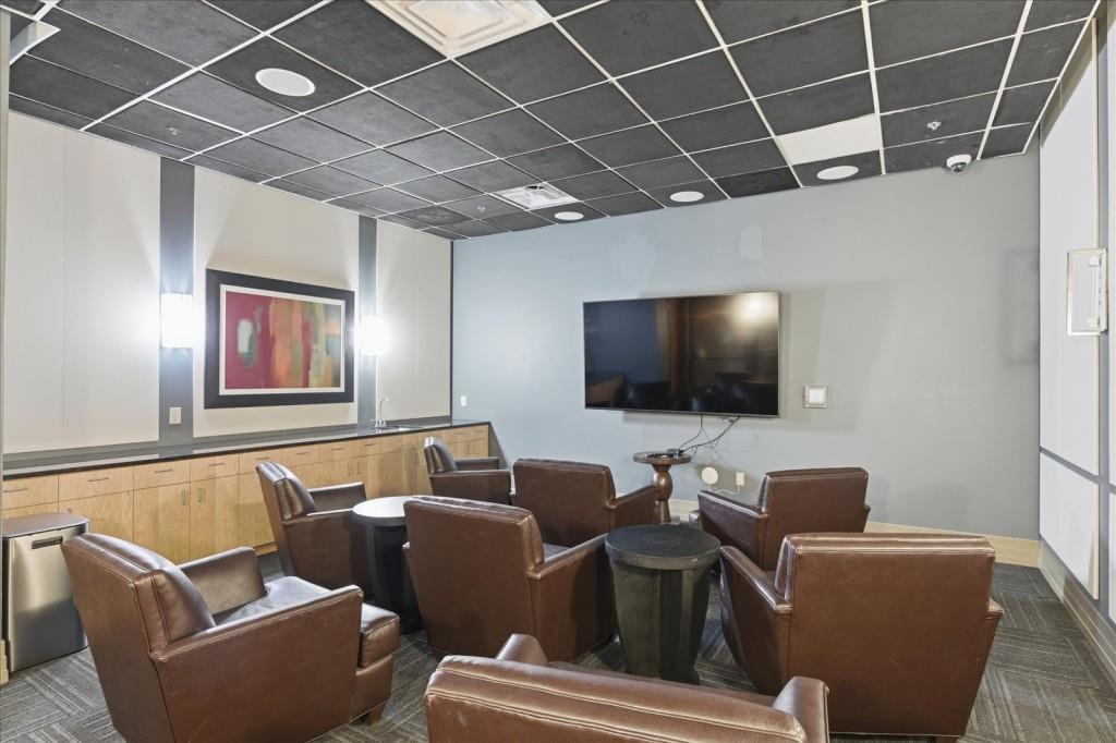 3040 Peachtree Road Northwest, Unit 805 Atlanta, GA 30305 - Photo 36 of 36 a living room with furniture and a flat screen tv