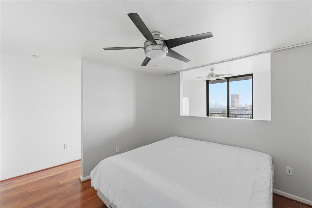 3040 Peachtree Road Northwest, Unit 805 Atlanta, GA 30305 - Photo 5 of 36 a bedroom with a bed and a window