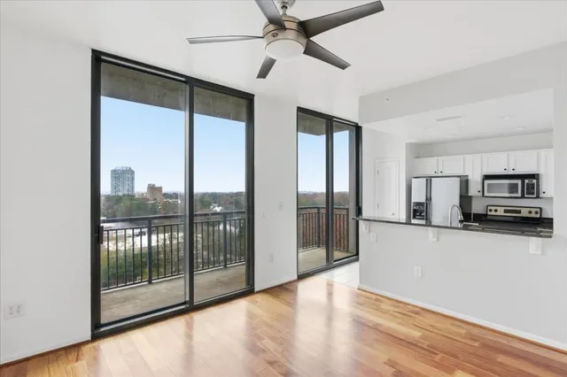 a view of a kitchen with a sink and a window