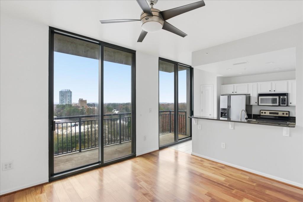 3040 Peachtree Road Northwest, Unit 805 Atlanta, GA 30305 - Photo 8 of 36 a view of a kitchen with a sink and a window
