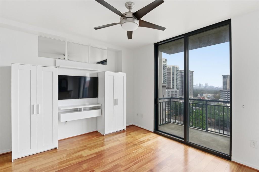 3040 Peachtree Road Northwest, Unit 805 Atlanta, GA 30305 - Photo 10 of 36 a view of kitchen with stainless steel appliances wooden floor and window