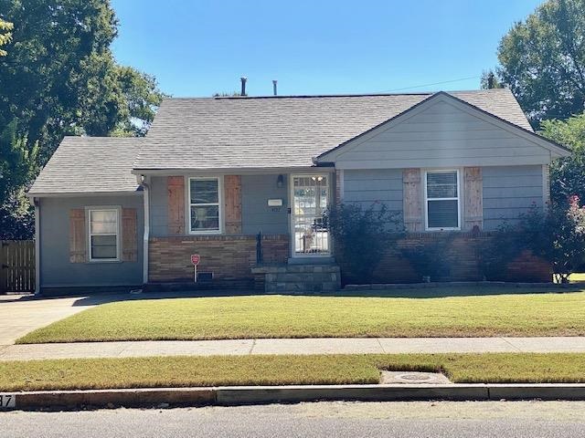 4787 Flamingo Road Memphis, TN 38117 - Photo 1 of 18 a front view of a house with a yard