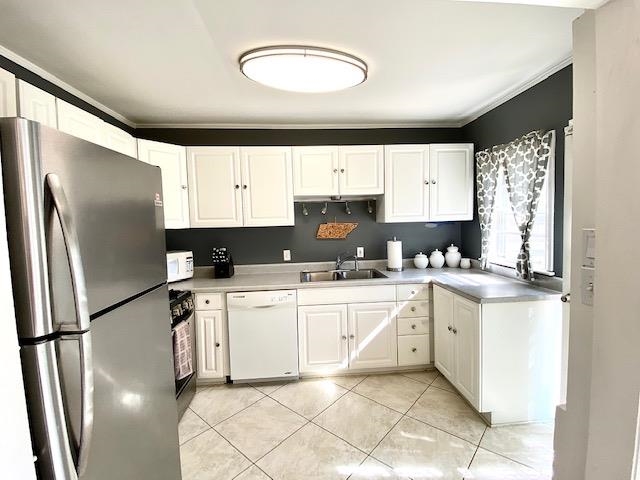4787 Flamingo Road Memphis, TN 38117 - Photo 5 of 18 a kitchen with a white cabinets and white appliances