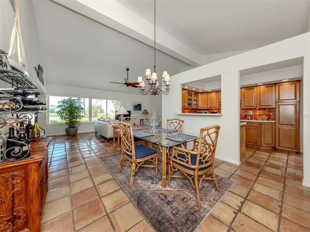786 Sarabay Road, Unit 19 Osprey, FL 34229 - Photo 14 of 60 a view of a dining room with furniture and a chandelier