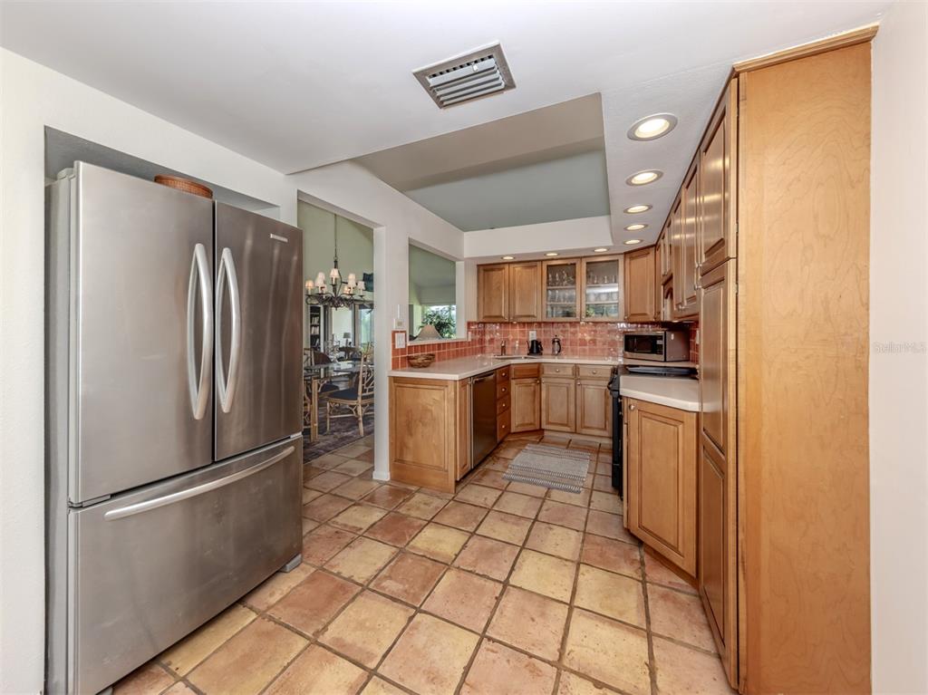 786 Sarabay Road, Unit 19 Osprey, FL 34229 - Photo 16 of 60 a kitchen with stainless steel appliances a refrigerator sink and microwave