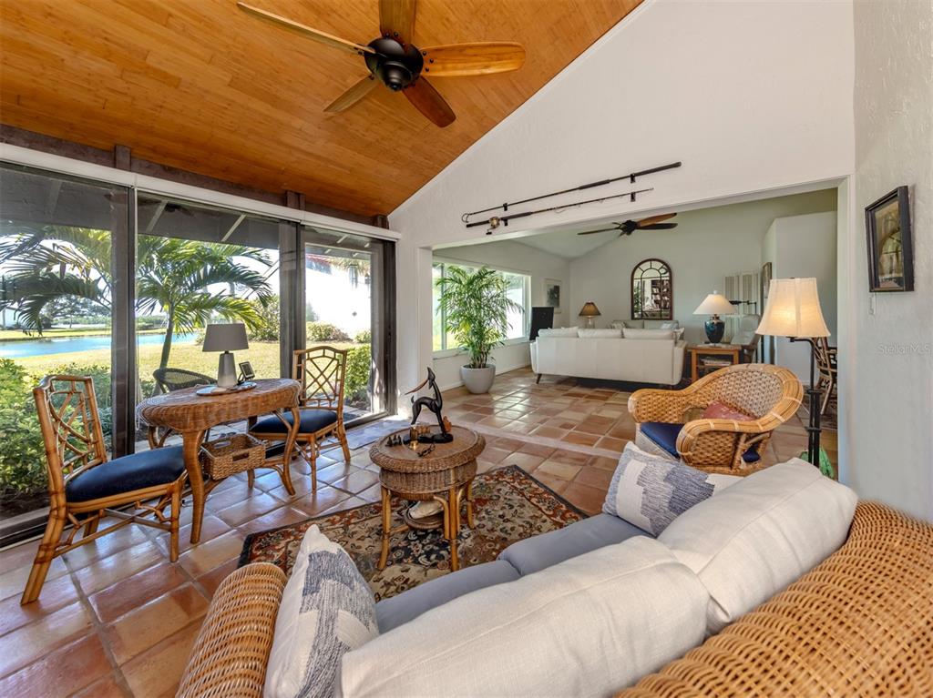 786 Sarabay Road, Unit 19 Osprey, FL 34229 - Photo 22 of 60 a living room with furniture ceiling fan and a large window