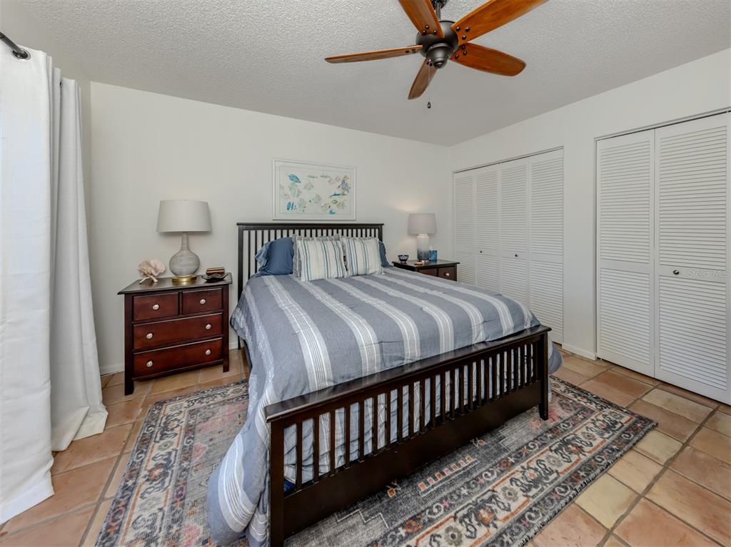 786 Sarabay Road, Unit 19 Osprey, FL 34229 - Photo 30 of 60 a bedroom with a bed and a window