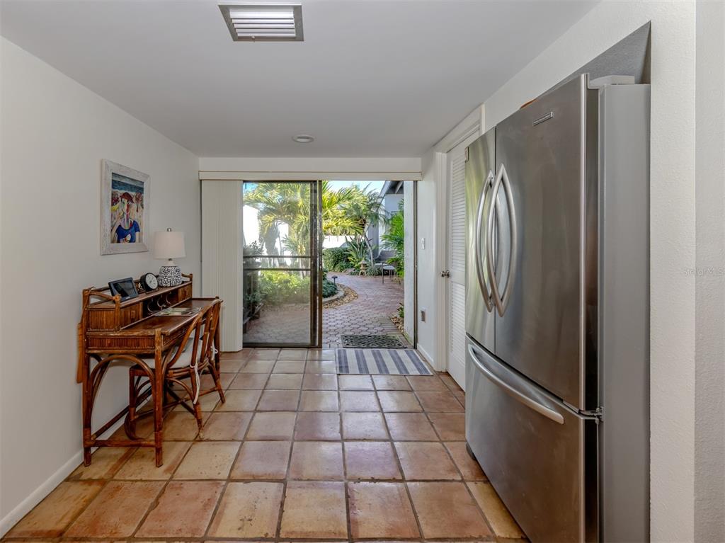 786 Sarabay Road, Unit 19 Osprey, FL 34229 - Photo 32 of 60 a kitchen with stainless steel appliances granite countertop a refrigerator and a sink