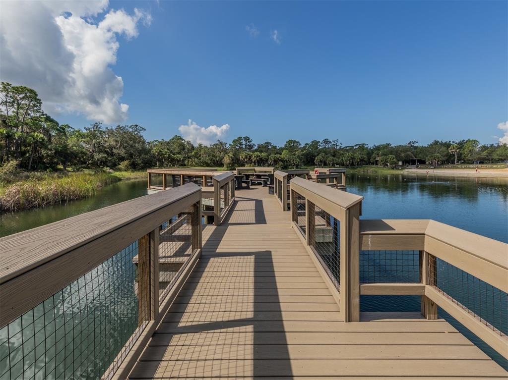 786 Sarabay Road, Unit 19 Osprey, FL 34229 - Photo 50 of 60 a view of a wooden deck and city view