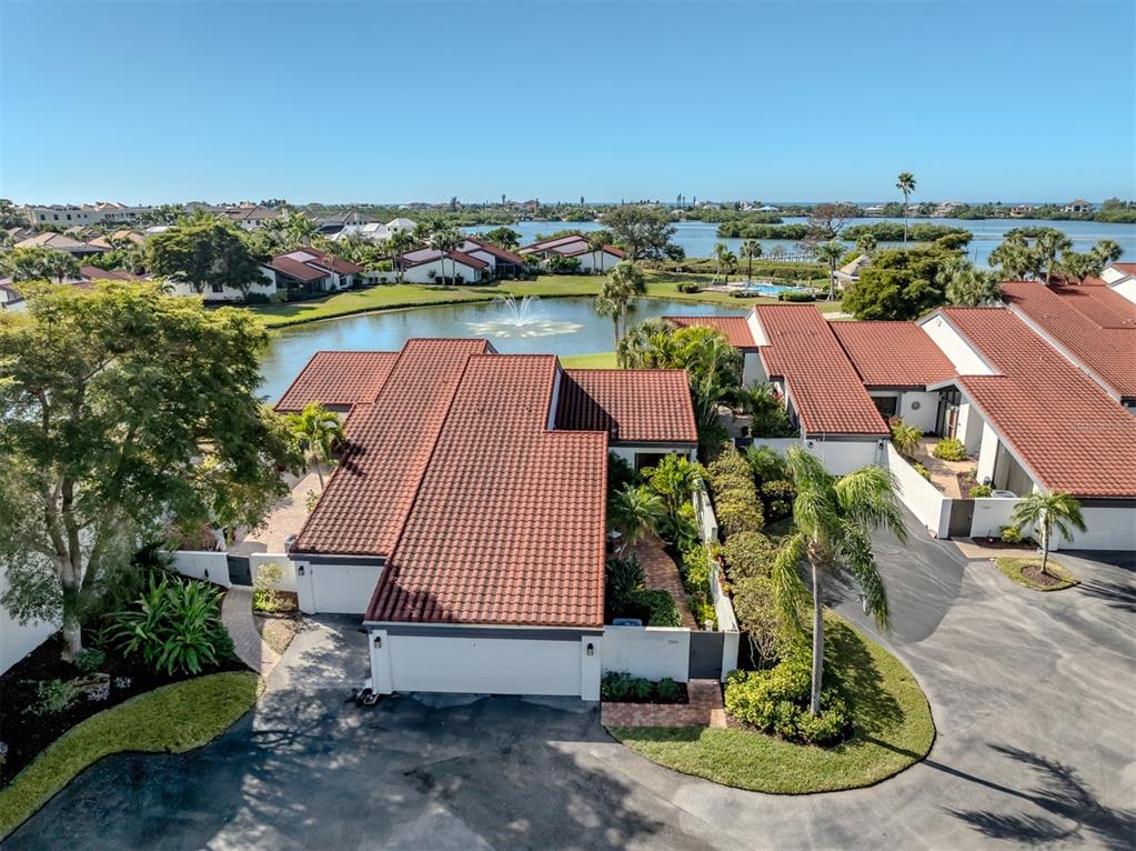 786 Sarabay Road, Unit 19 Osprey, FL 34229 - Photo 57 of 60 an aerial view of a house with a yard lake view and mountain view in back