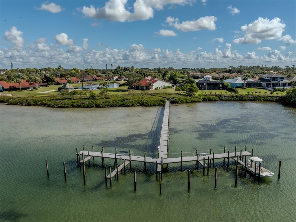 786 Sarabay Road, Unit 19 Osprey, FL 34229 - Photo 59 of 60 an aerial view of a house with a lake view