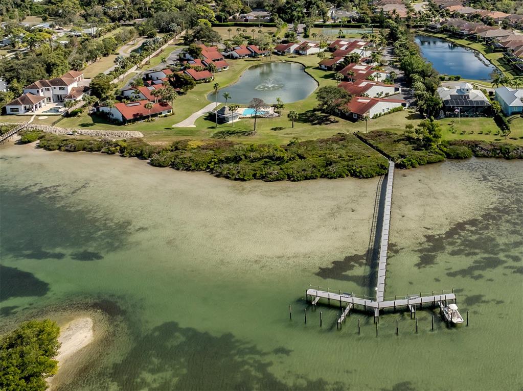 786 Sarabay Road, Unit 19 Osprey, FL 34229 - Photo 6 of 60 an aerial view of a house with a yard