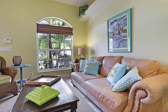 a living room with furniture and a window
