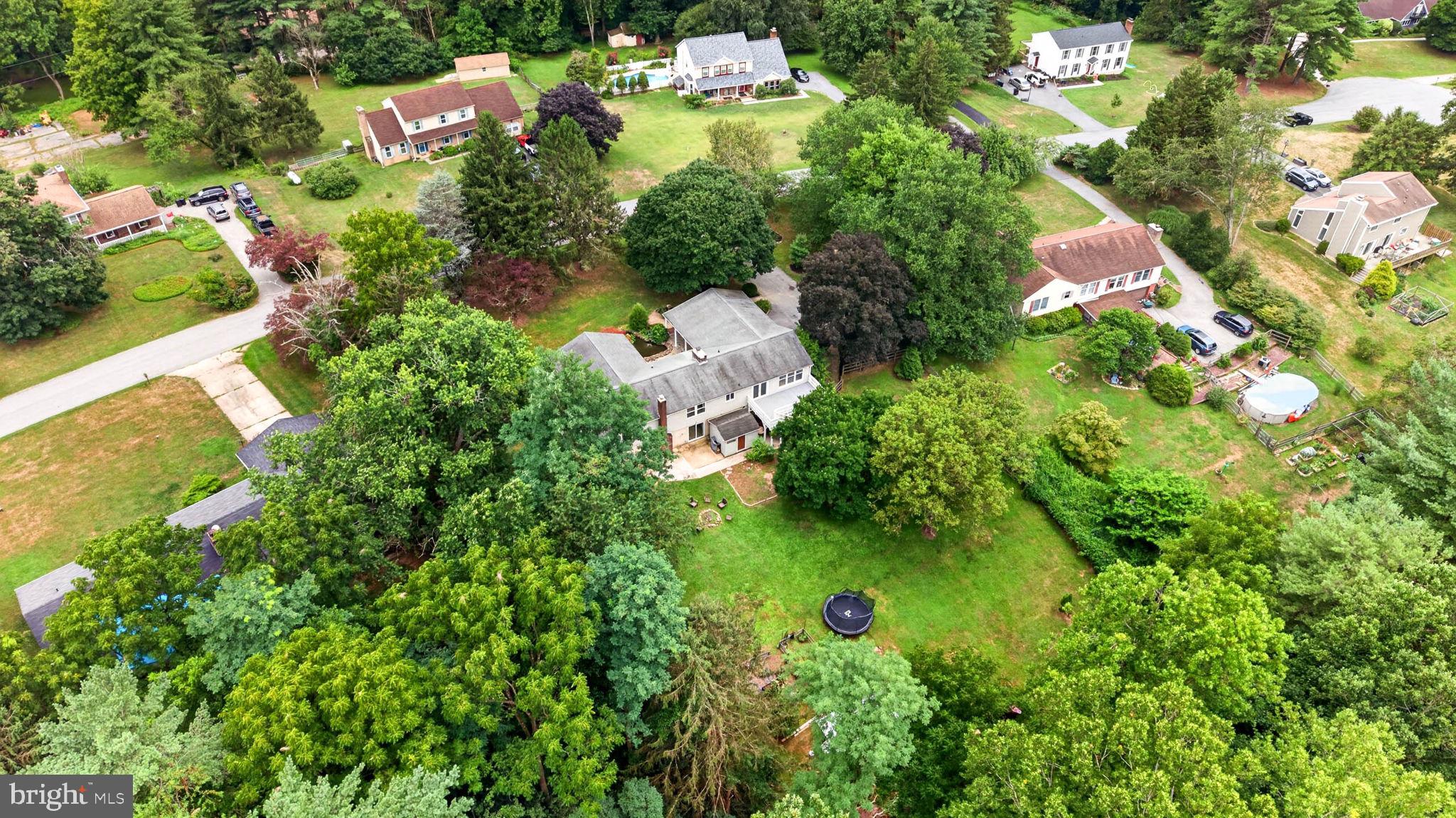 8 Manor Brook Road Monkton, MD 21111 - Photo 51 of 60 Lush greenery surrounds a charming home.