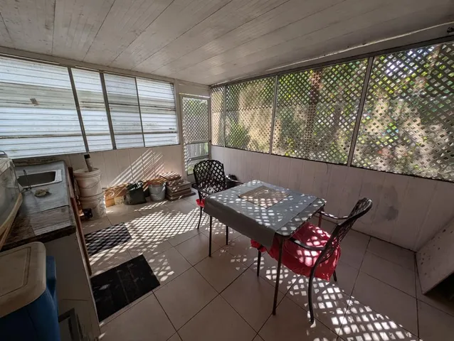 a view of a balcony dining area