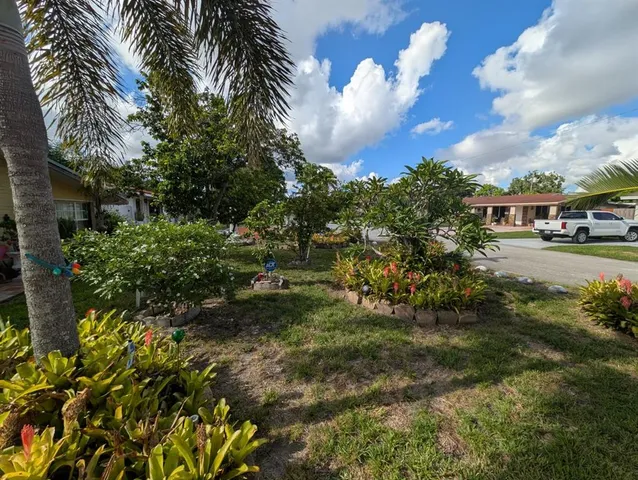 a view of a yard and mountains