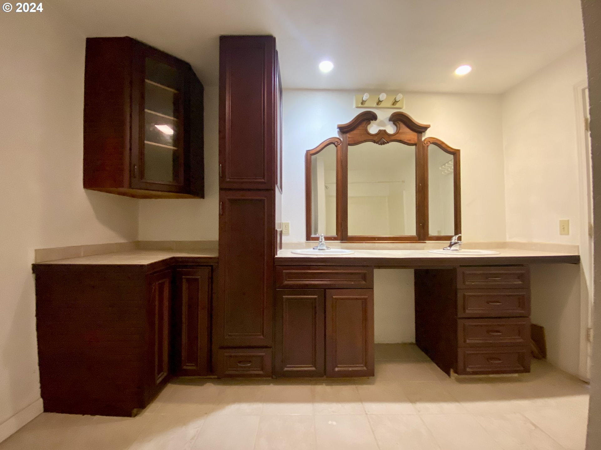 1027 Mill Street Springfield, OR 97477 - Photo 23 of 47 a hallway with a sink and a mirror