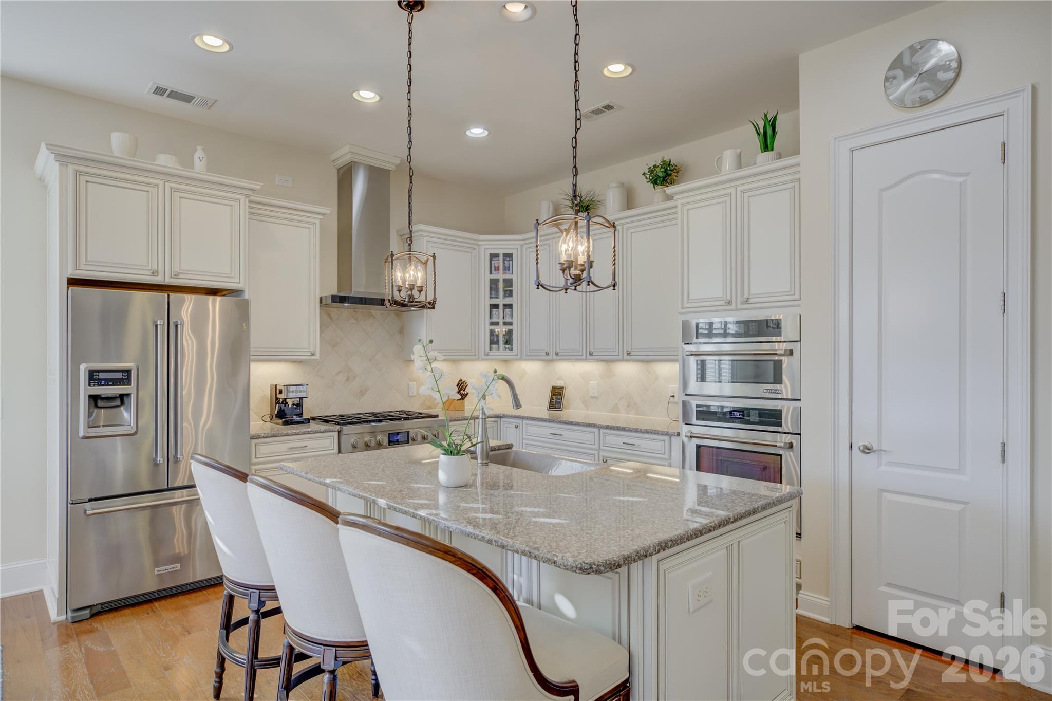 15511 Lake Ridge Road Charlotte, NC 28278 - Photo 11 of 46 a kitchen with kitchen island a sink appliances and wooden floor