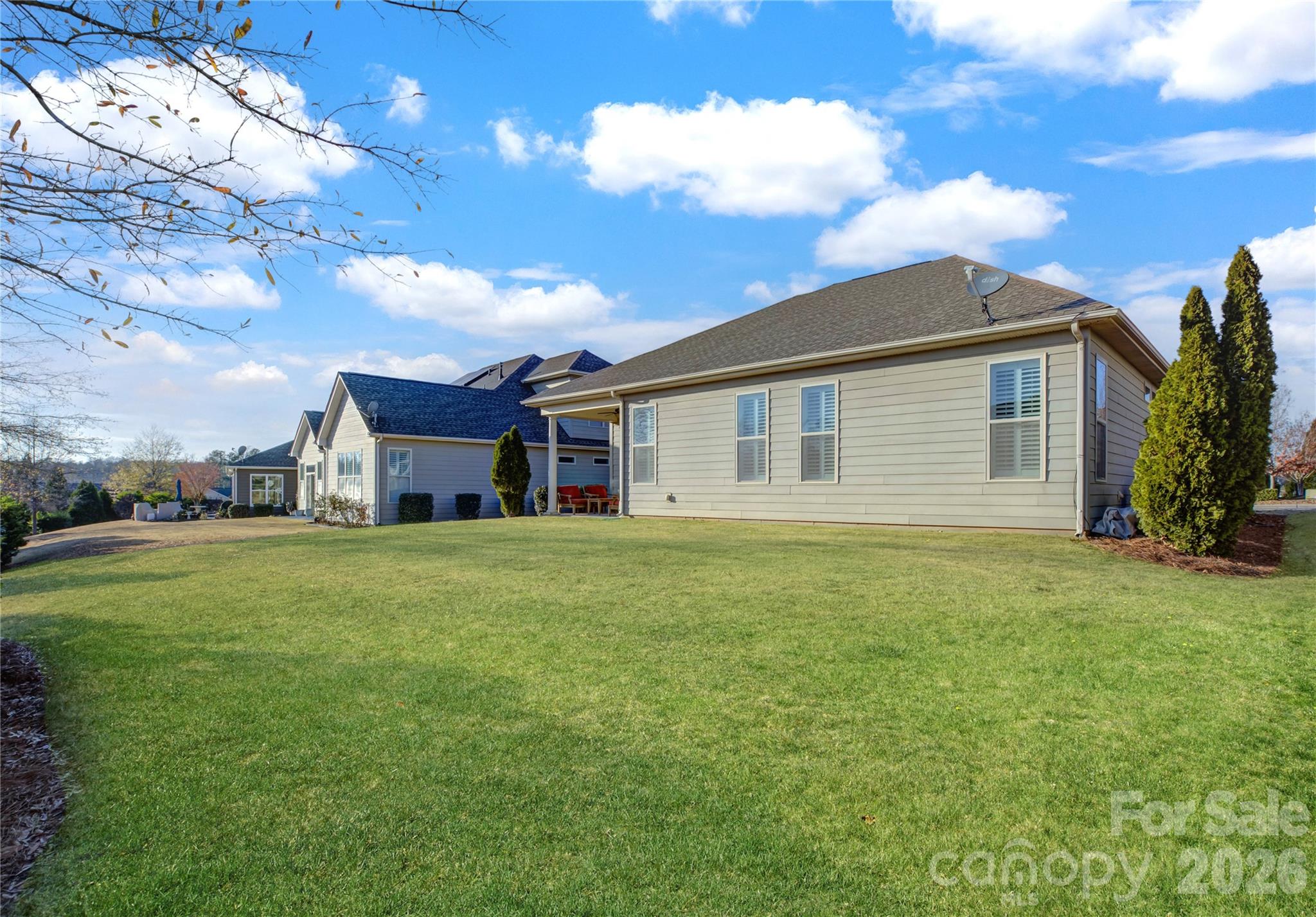 15511 Lake Ridge Road Charlotte, NC 28278 - Photo 2 of 46 a view of a yard in front of a house with a large tree