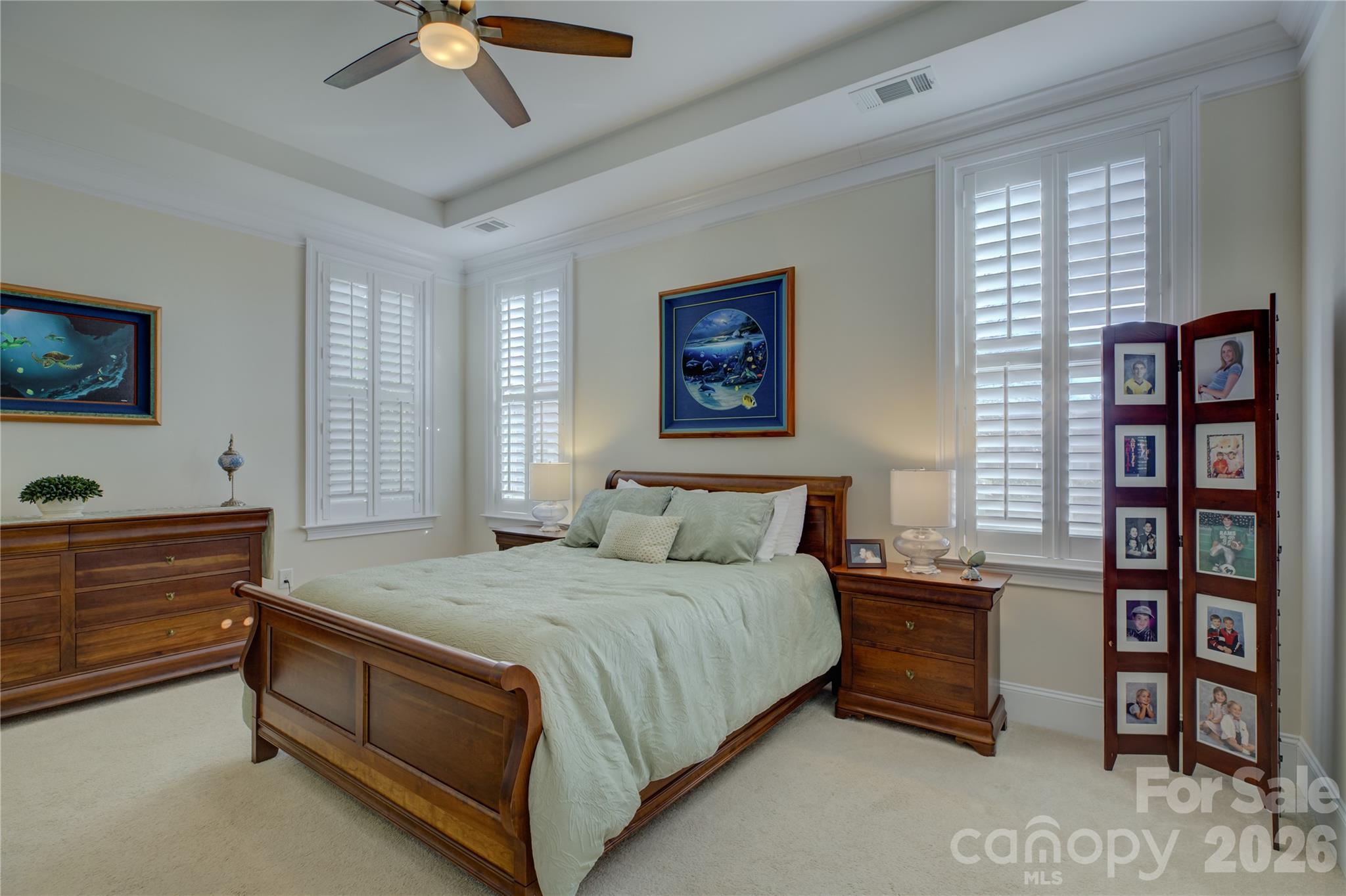 15511 Lake Ridge Road Charlotte, NC 28278 - Photo 21 of 46 a bed room with a bed and a television