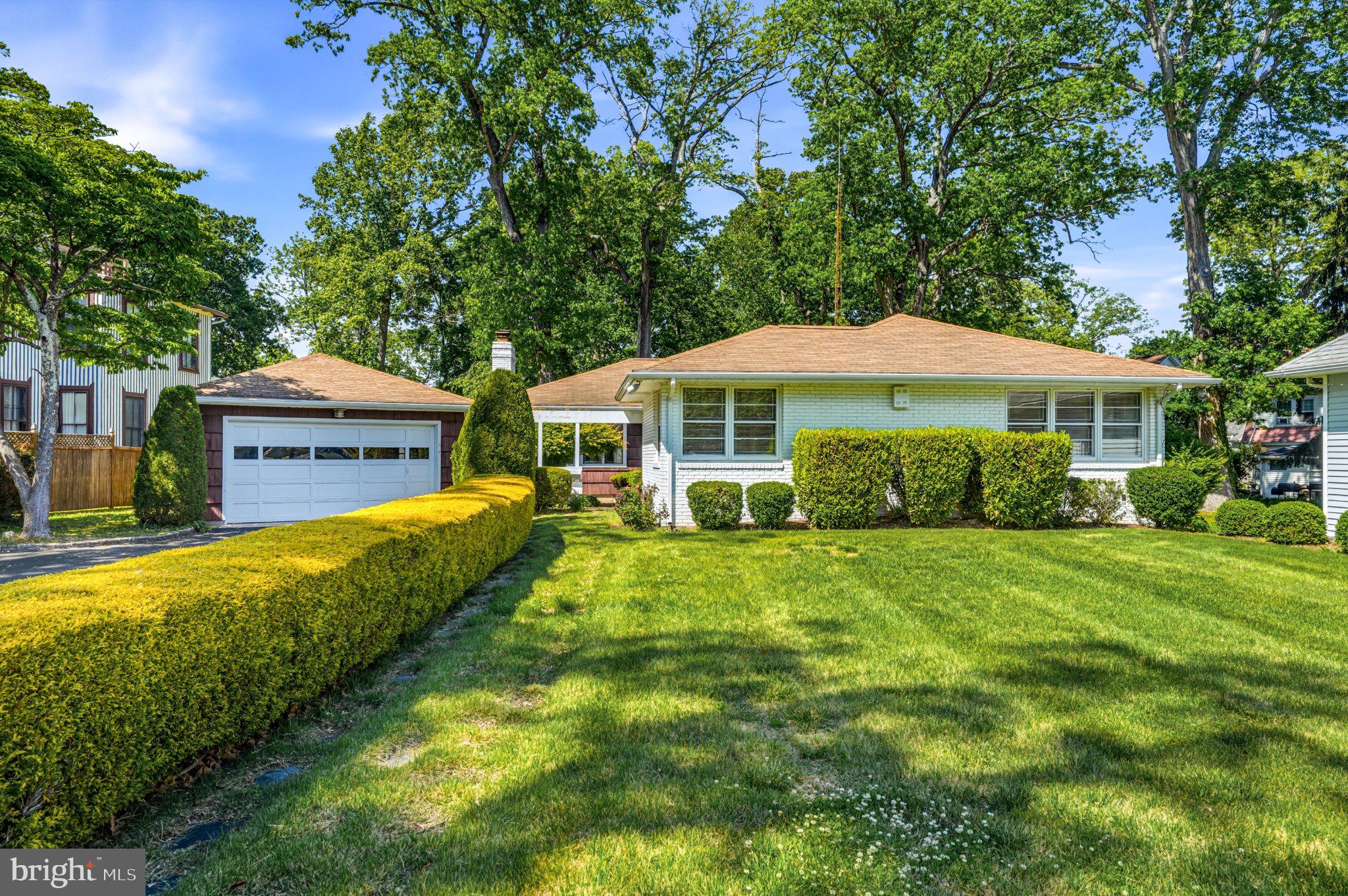Charming home with lush greenery.