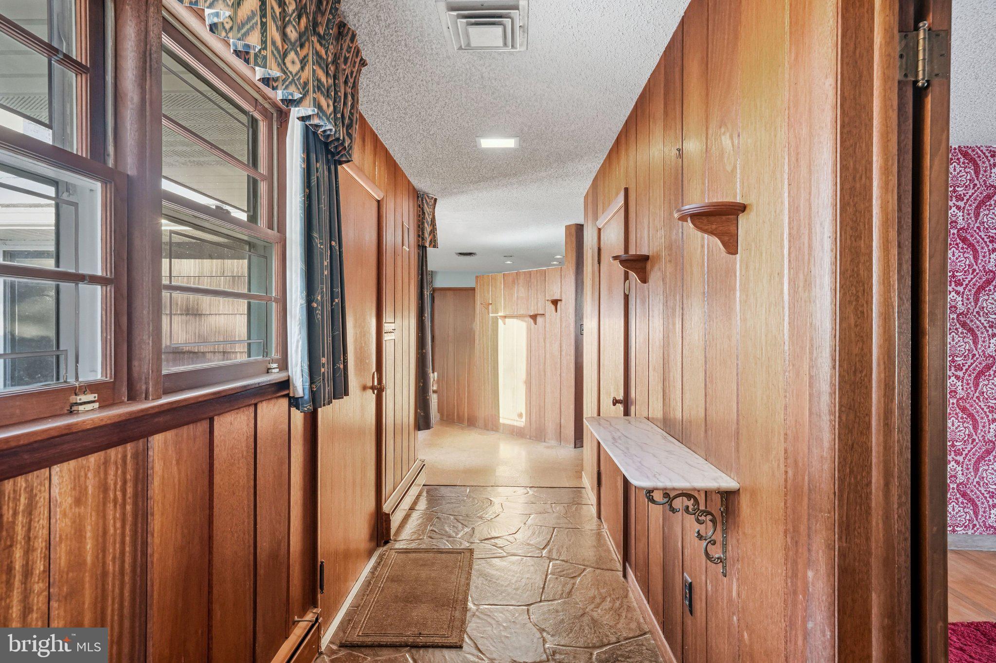 23 Lake Street Bridgeton, NJ 08302 - Photo 17 of 64 Warm wooden hallway with natural light.