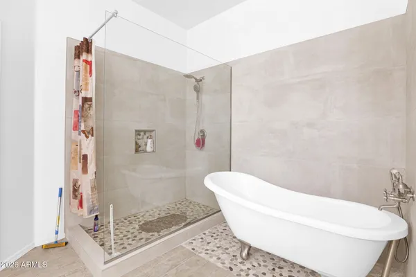 a living room with furniture and kitchen view