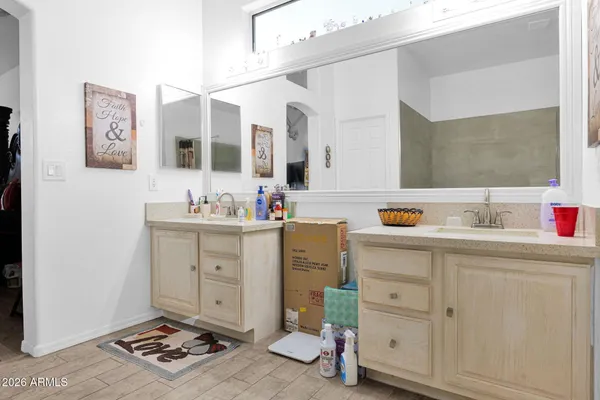 a kitchen with cabinets and wooden floor