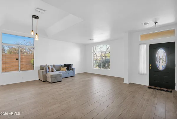 a living room with furniture and a window