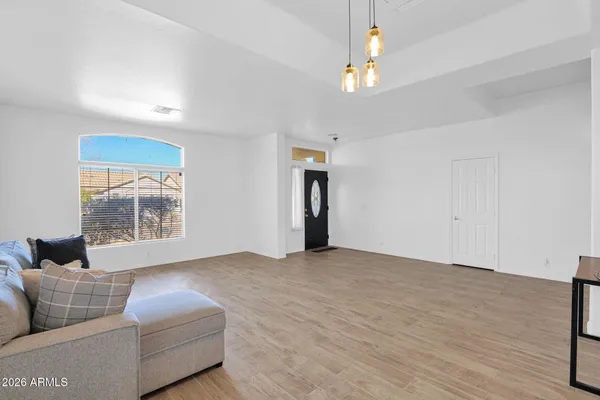 a living room with furniture and a window