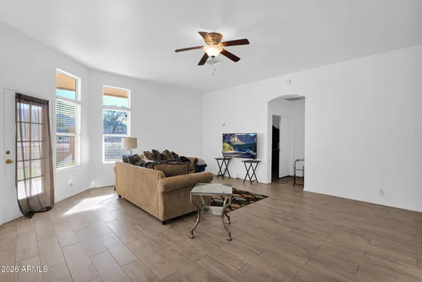 a living room with furniture and a chandelier