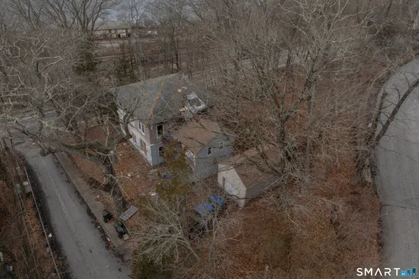an aerial view of residential house with outdoor space