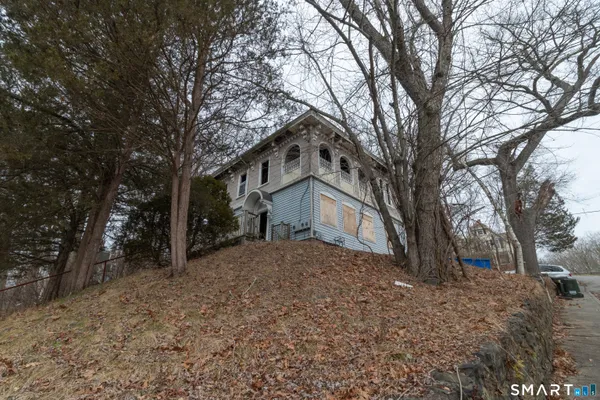a view of a house with a snow in the forest