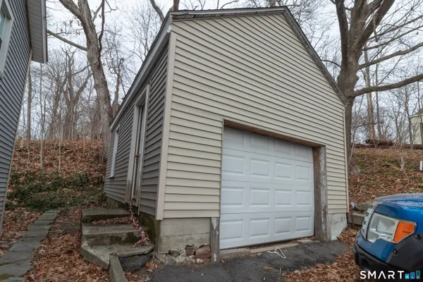 a view of a house with a yard and garage