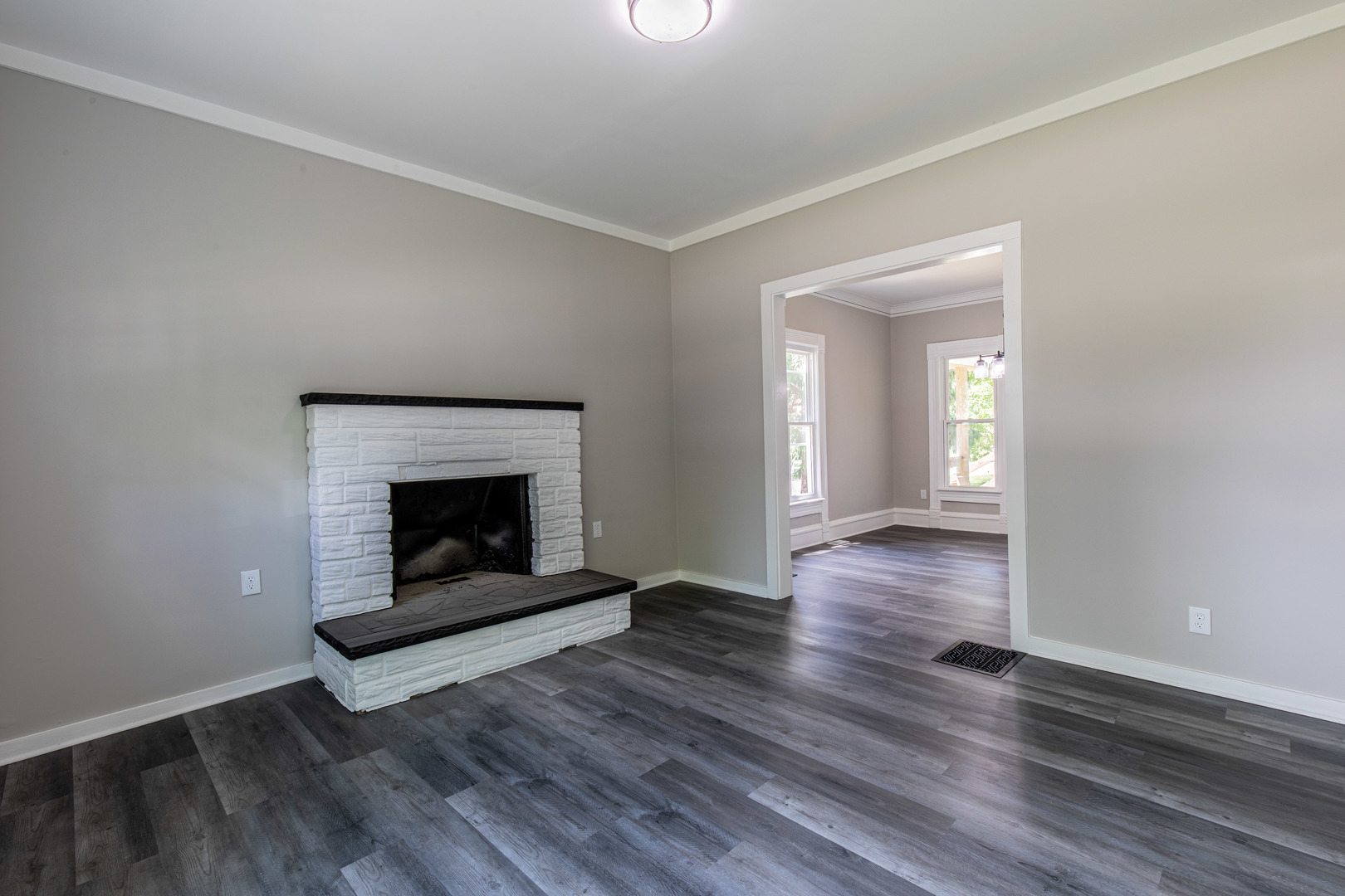 324 Sumner Street Streator, IL 61364 - Photo 13 of 18 an empty room with wooden floor fireplace and windows