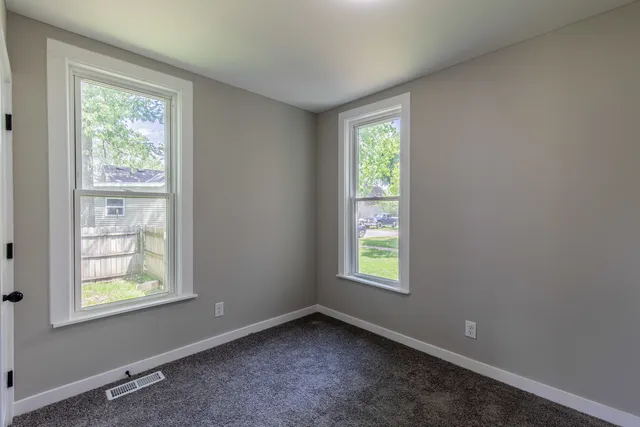 an empty room with windows