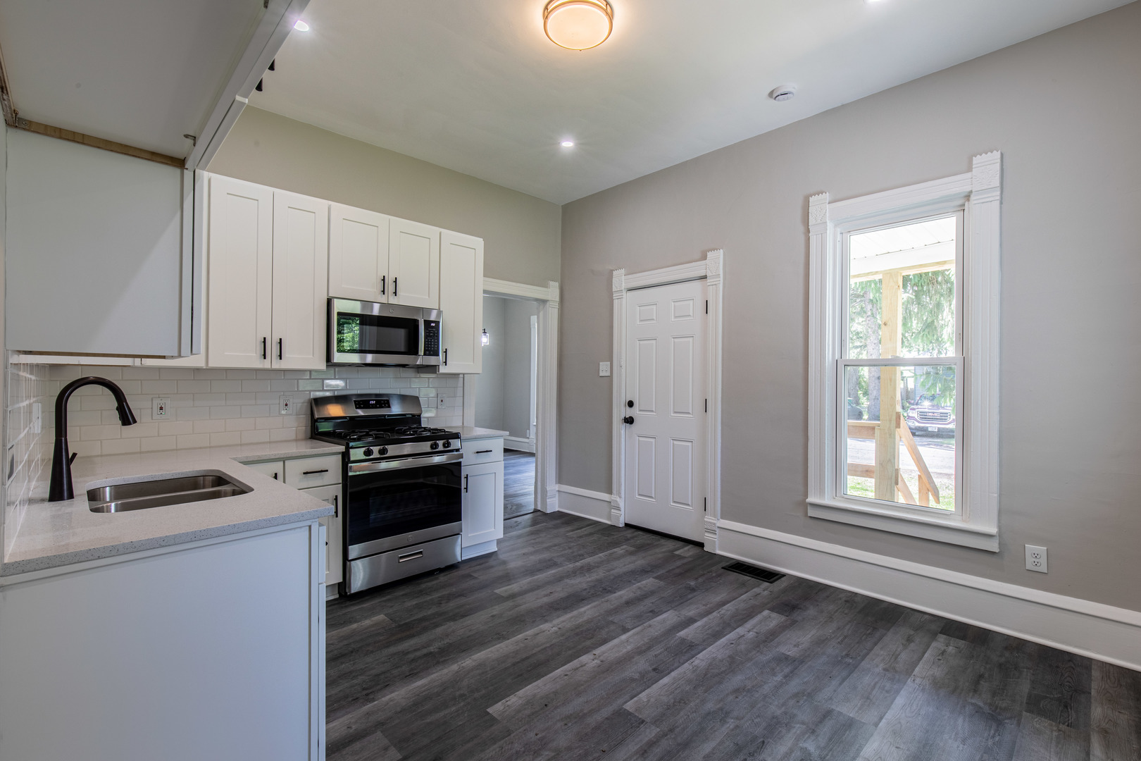 324 Sumner Street Streator, IL 61364 - Photo 7 of 18 a kitchen with sink a microwave and cabinets
