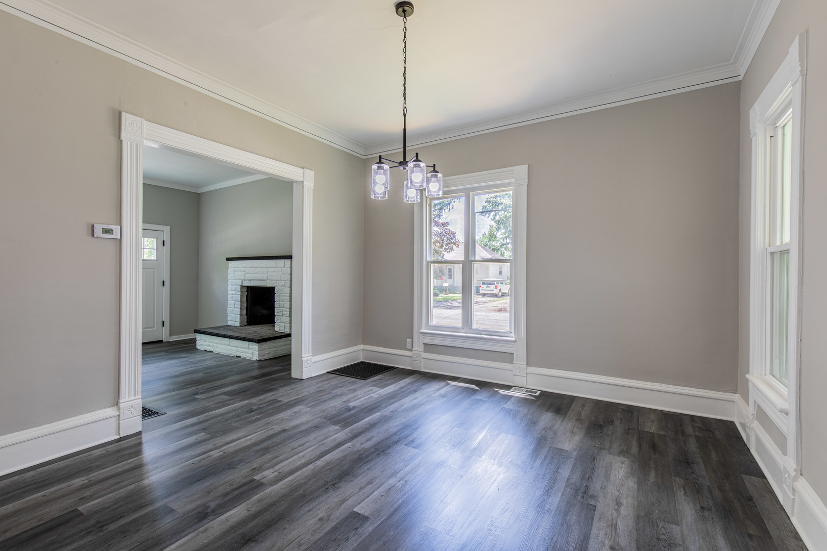324 Sumner Street Streator, IL 61364 - Photo 9 of 18 a view of a room with wooden floor fireplace and windows