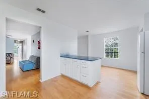 a view of kitchen and windows