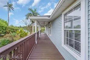 a view of a balcony with wooden floor