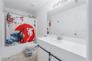 a bathroom with a sink mirror and vanity