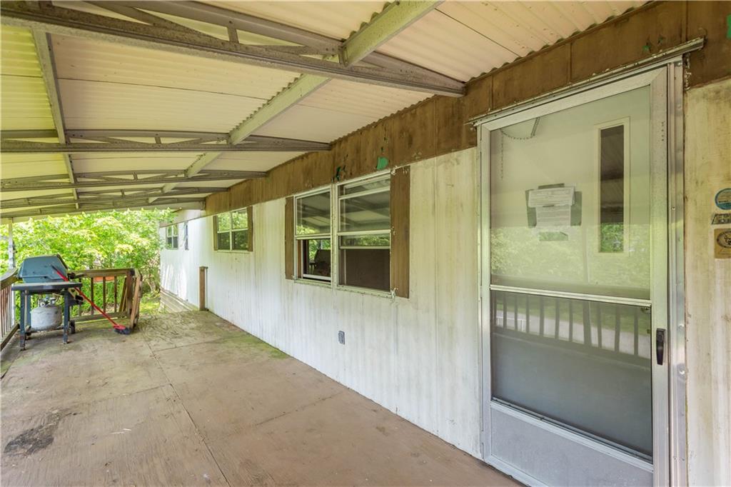 114 Ontario Road Scenery Hill, PA 15360 - Photo 5 of 18 a view of a porch with a table and chairs