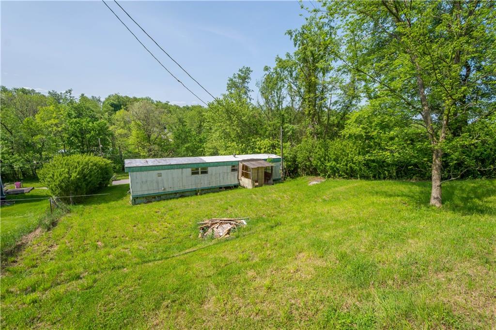 114 Ontario Road Scenery Hill, PA 15360 - Photo 9 of 18 a view of a backyard with plants and large trees
