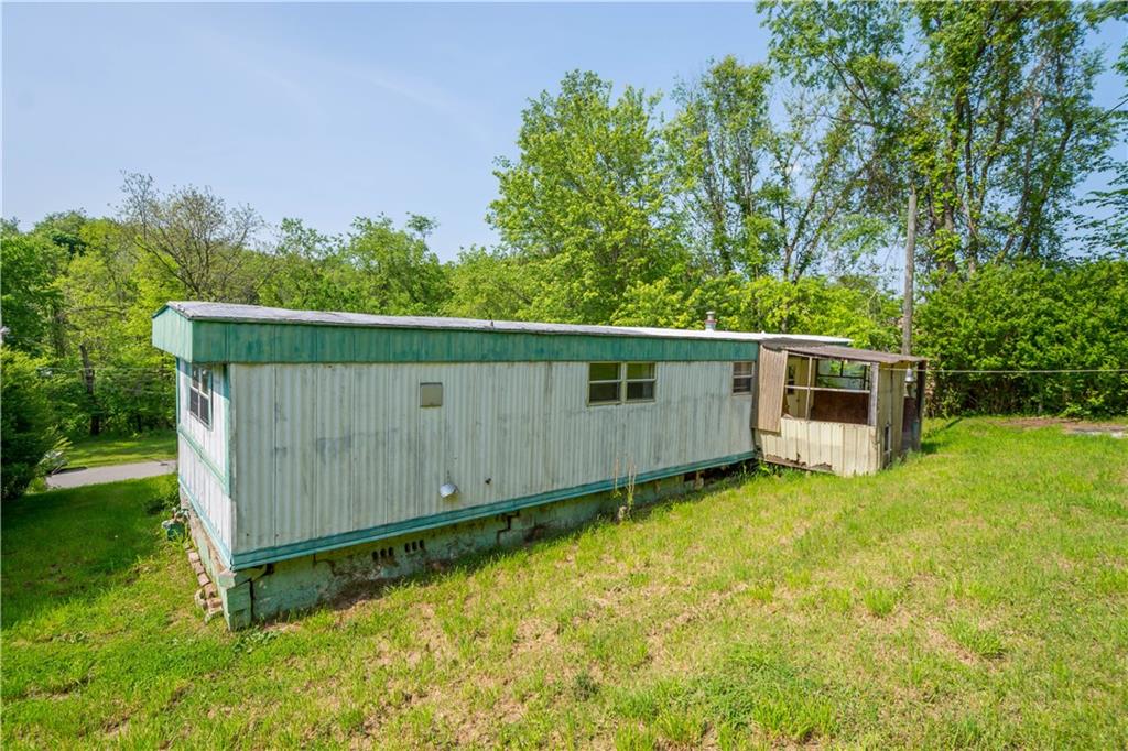 114 Ontario Road Scenery Hill, PA 15360 - Photo 10 of 18 a backyard of a house with lawn chairs plants and tree