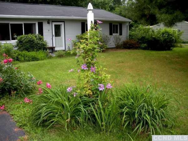 10 Robin Road Kinderhook, NY 12106 - Photo 2 of 10 a view of a house with potted plants and a yard