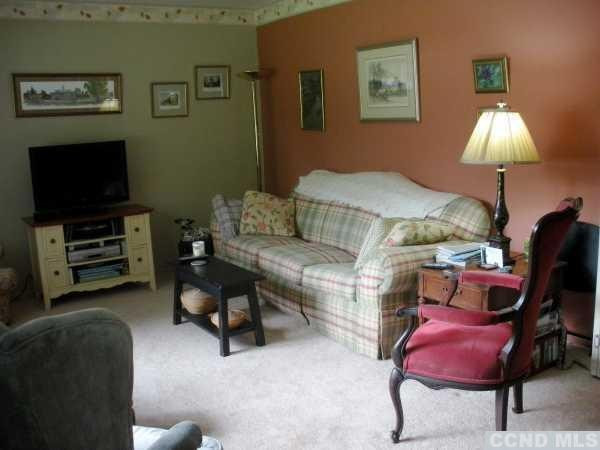 10 Robin Road Kinderhook, NY 12106 - Photo 3 of 10 a living room with furniture and a flat screen tv